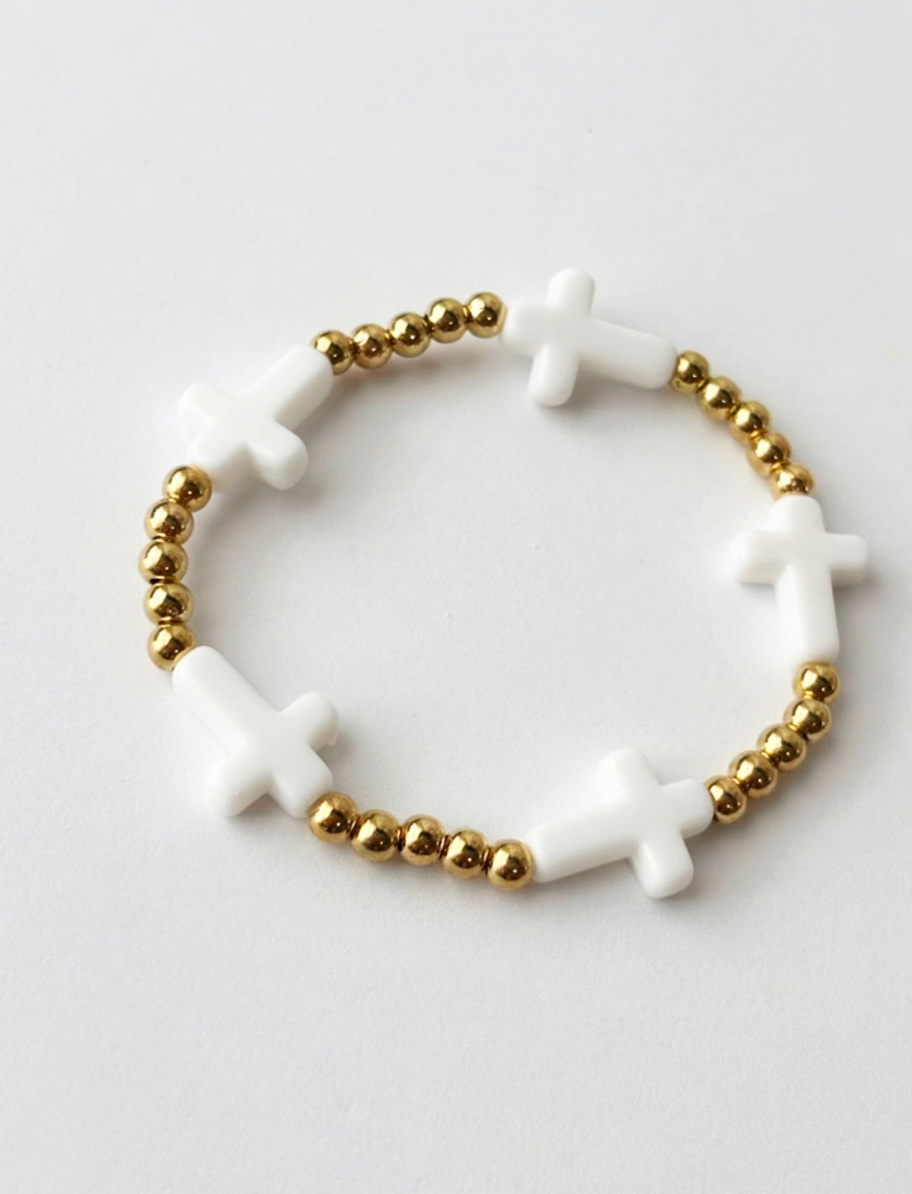Gold and white cross bracelet